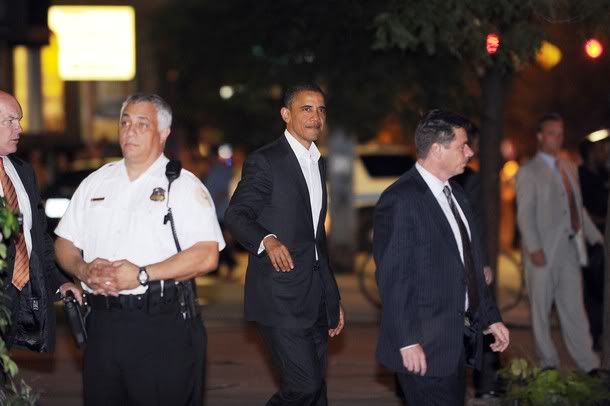 US President Barack Obama leaves after having dinner at a local restaurant in Chicago, Illinois, on August 4, 2010.