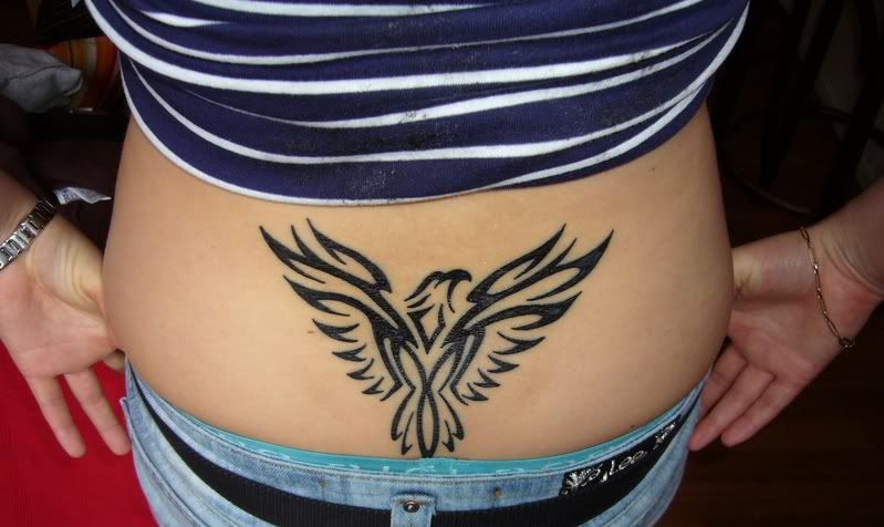 tribal eagle tattoo on lower back-954