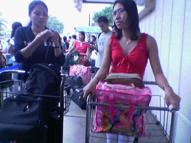 the lady in red who inserted herself in the queue